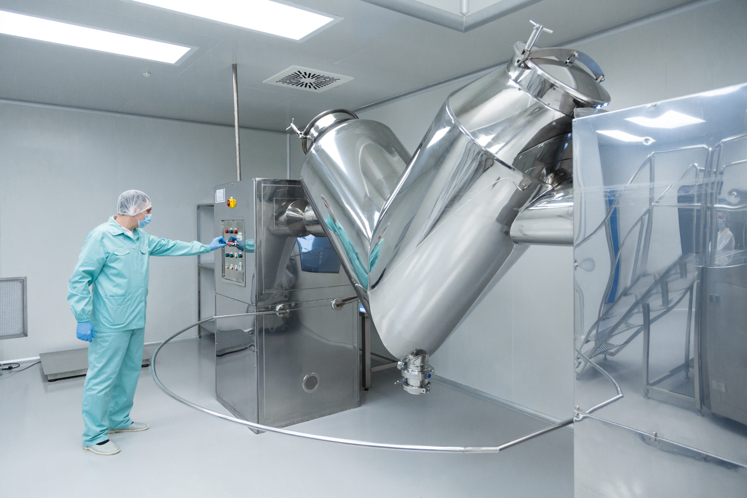 Pharmaceutical technician in sterile environment at pharmacy industry